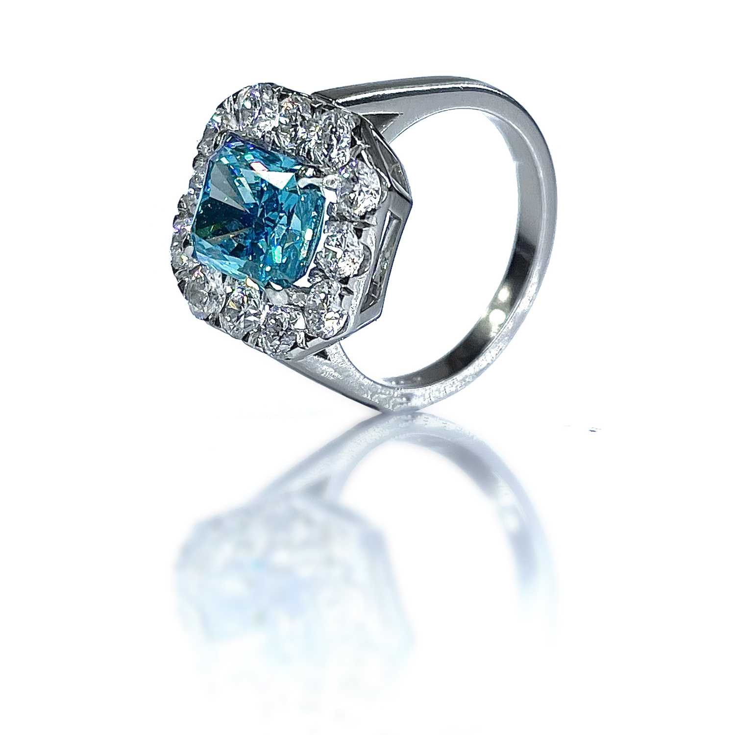 Lot 7 - An exquisite fancy vivid blue diamond set...