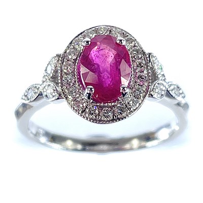 Lot 56 - An 18ct white gold ruby diamond cluster ring,...