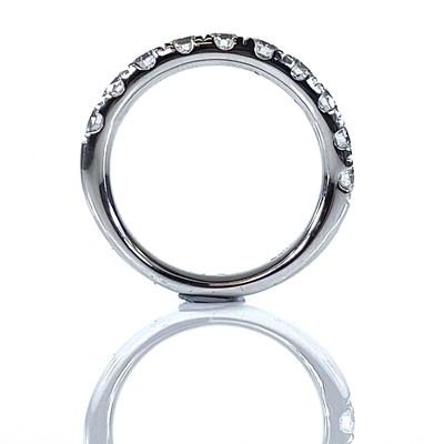 Lot 197 - A platinum diamond set half eternity ring, the...