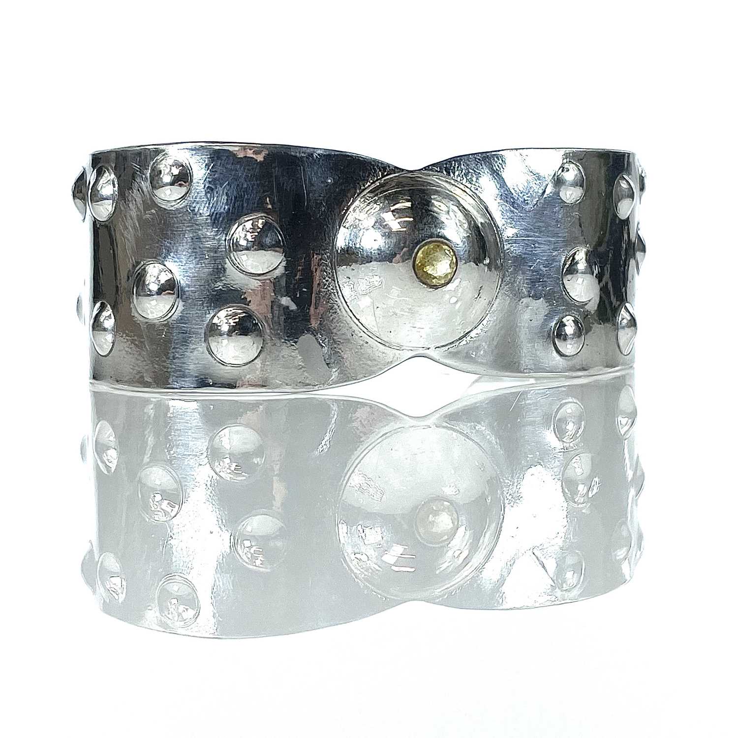 Lot 231 - A 999 fine silver Viking bracelet by James Suddaby.
