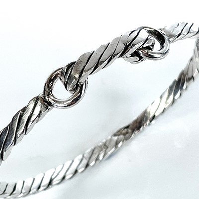 Lot 285 - A 999 fine silver Newlyn Rope bangle by James...