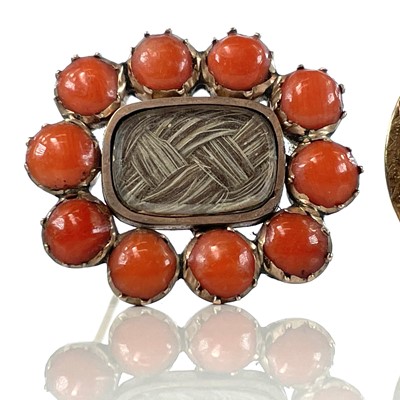 Lot 78 - A 19th century rose gold coral set mourning...