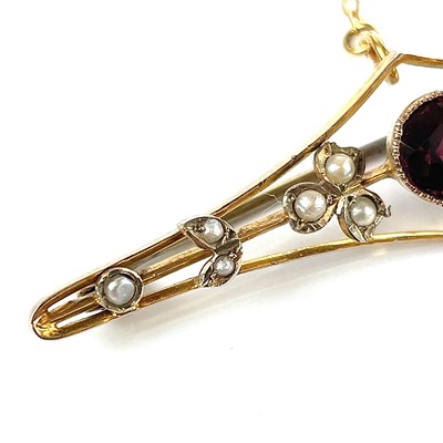 Lot 26 - A 9ct gold garnet and seed pearl set bar...