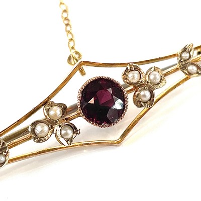 Lot 26 - A 9ct gold garnet and seed pearl set bar...