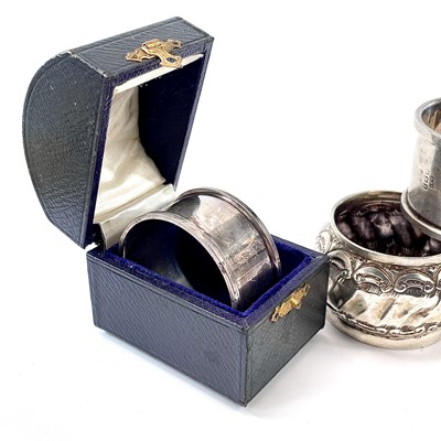 Lot 99 - Four silver hallmarked napkin rings, one cased,...