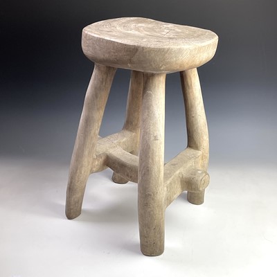 Lot 246 - An African tribal hardwood stool carved from a...