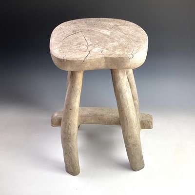 Lot 246 - An African tribal hardwood stool carved from a...