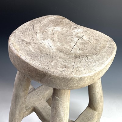 Lot 246 - An African tribal hardwood stool carved from a...