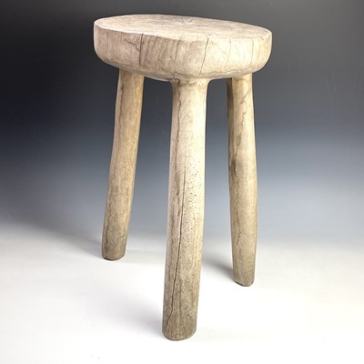 Lot 246 - An African tribal hardwood stool carved from a...