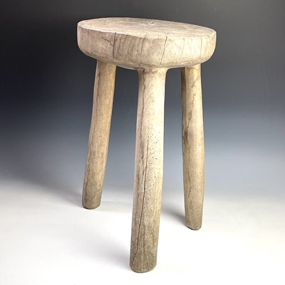 Lot 246 - An African tribal hardwood stool carved from a...