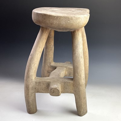 Lot 246 - An African tribal hardwood stool carved from a...