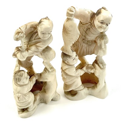 Lot 253 - A pair of Japanese Meiji period carved ivory...