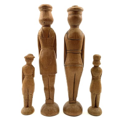 Lot 48 - A pair of pitch pine folk art peg figures of a French sailor and a lady.