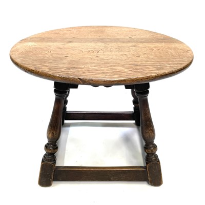 Lot 61 - An oak circular low table, circa 1920's.