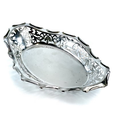 Lot 133 - A George V silver oval dish with scroll...