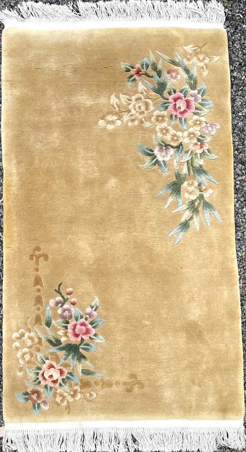 Lot 1237 - A Chinese rug, mid 20th century, with two