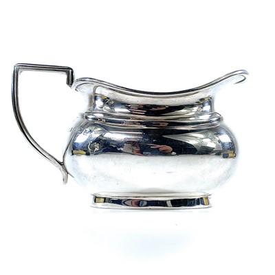 Lot 193 - A George V silver three piece tea set by...