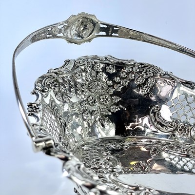 Lot 59 - An attractive Edwardian silver swing handled...