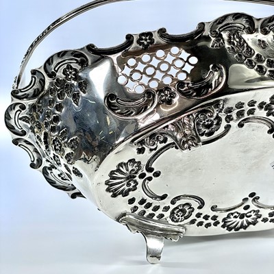 Lot 59 - An attractive Edwardian silver swing handled...