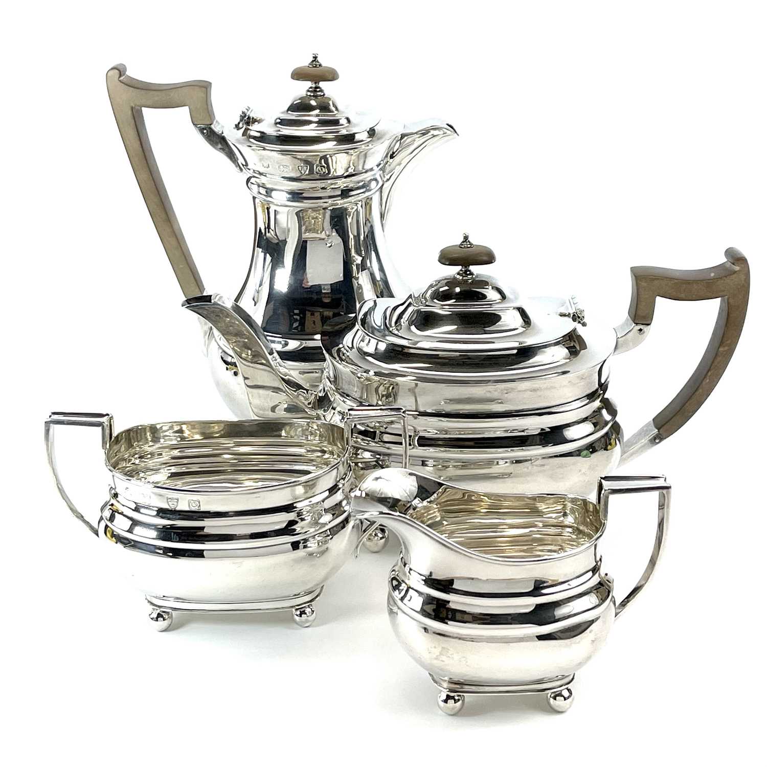 Lot 81 - A George VI silver four piece tea set by Lowe...