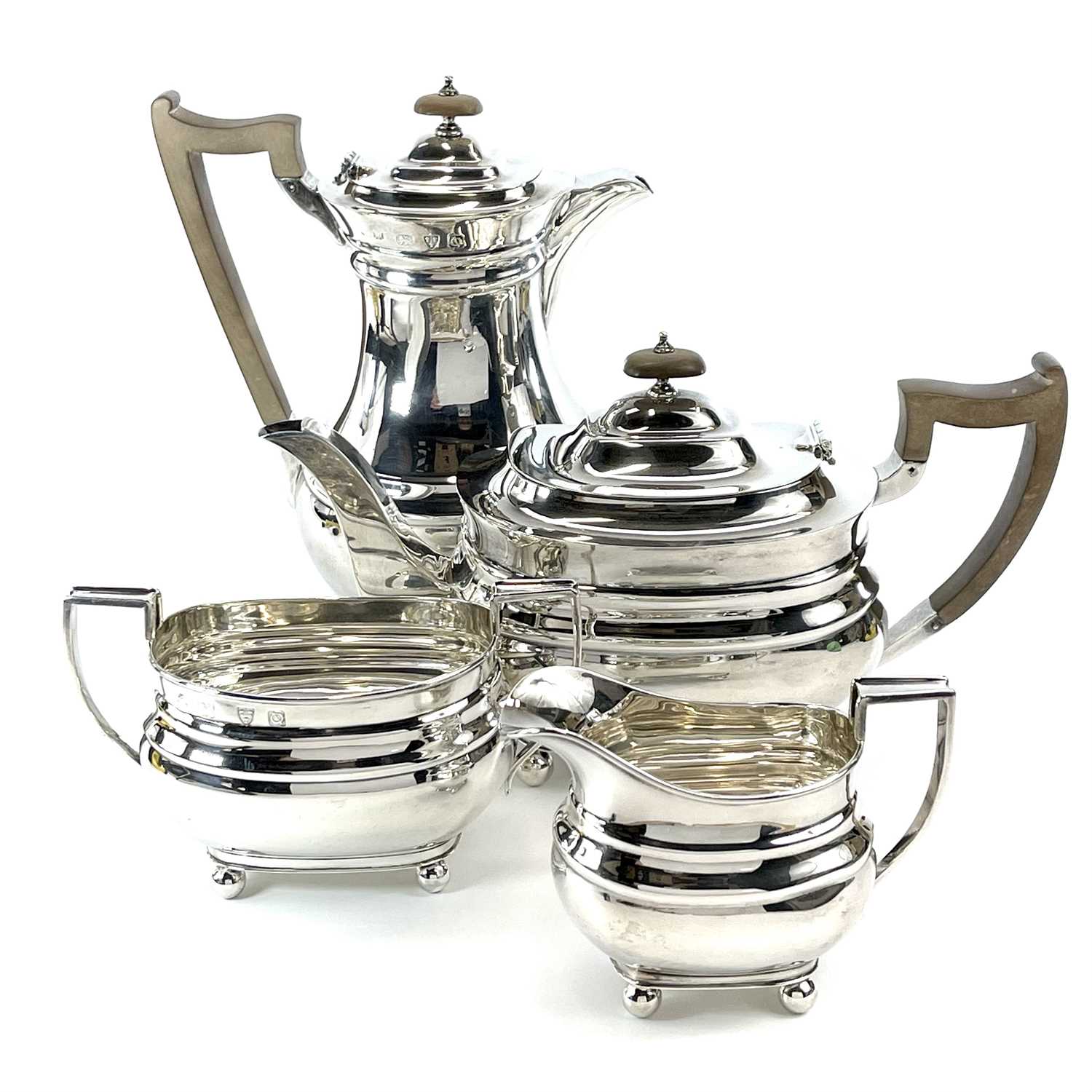 Lot 24 - A George VI silver four piece tea set by Lowe