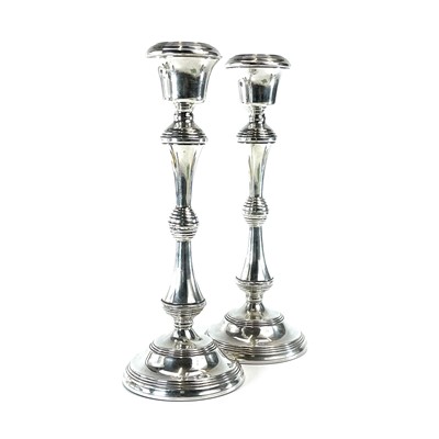 Lot 144 - A pair of modern silver weighted candlesticks,...
