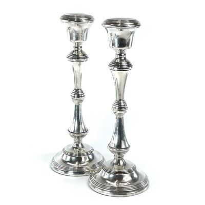 Lot 144 - A pair of modern silver weighted candlesticks,...