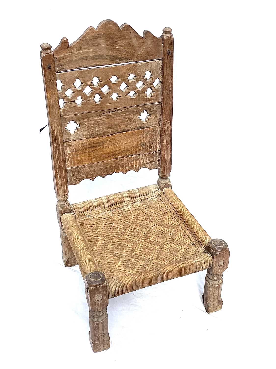 Lot 1015 - An Afghan carved wood low chair, 19th