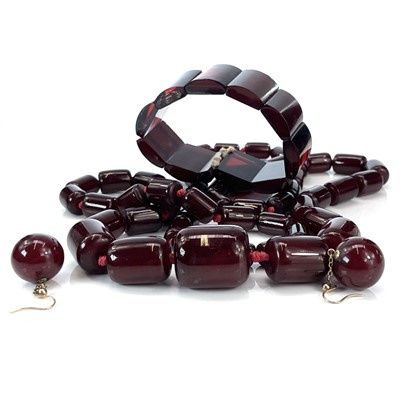 Lot 247 - A cherry 'amber' bakelite bead necklace,...