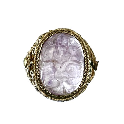 Lot 202 - A Chinese silver gilt filigree ring set with an oval amethyst.