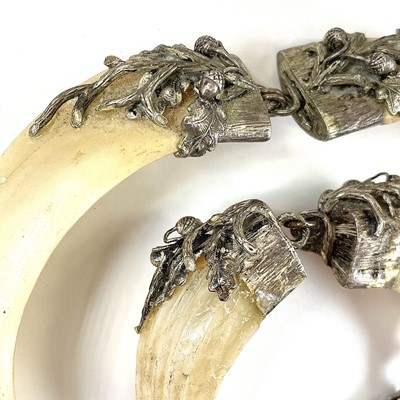 Lot 245 - A collection of stag's tooth white metal...