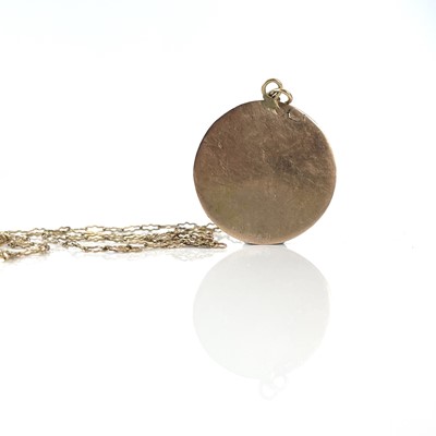 Lot 52 - A gold pendant crudely engraved with The...