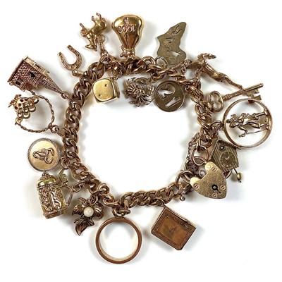 Lot 32 - A 9ct gold charm bracelet with 19 various 9ct...