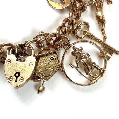 Lot 32 - A 9ct gold charm bracelet with 19 various 9ct...