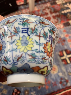 Lot 18 - A Chinese Doucai porcelain tea bowl, 18th...