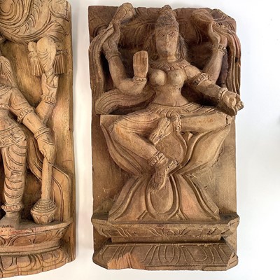 Lot 296 - Three carved wood panels of deities, early-mid...