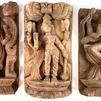 Lot 296 - Three carved wood panels of deities, early-mid...