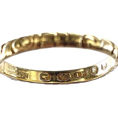 Lot 8 - An early Victorian 18ct hallmarked gold band...