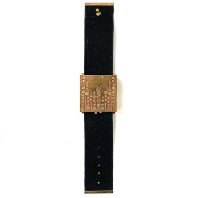 Lot 313 - An Yves Saint Laurent gilt metal bracelet...
