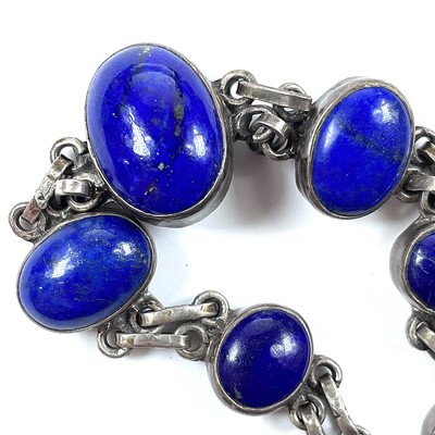 Lot 204 - A silver and lapis lazuli set bracelet, length...