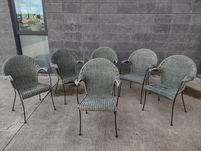 Lot 23 - A set of six raffia work garden chairs with...
