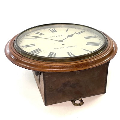 Lot 72 - A circular oak railway wall clock, late 19th century.