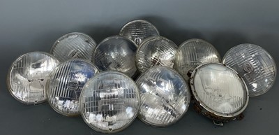 Lot 64 - Eleven car lights, without bulbs. (11)