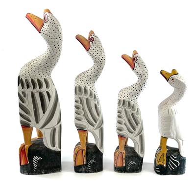 Lot 228 - Four graduating wood carved painted geese,...