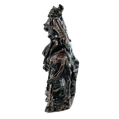 Lot 54 - A Chinese carved wood figure of a warrior on...