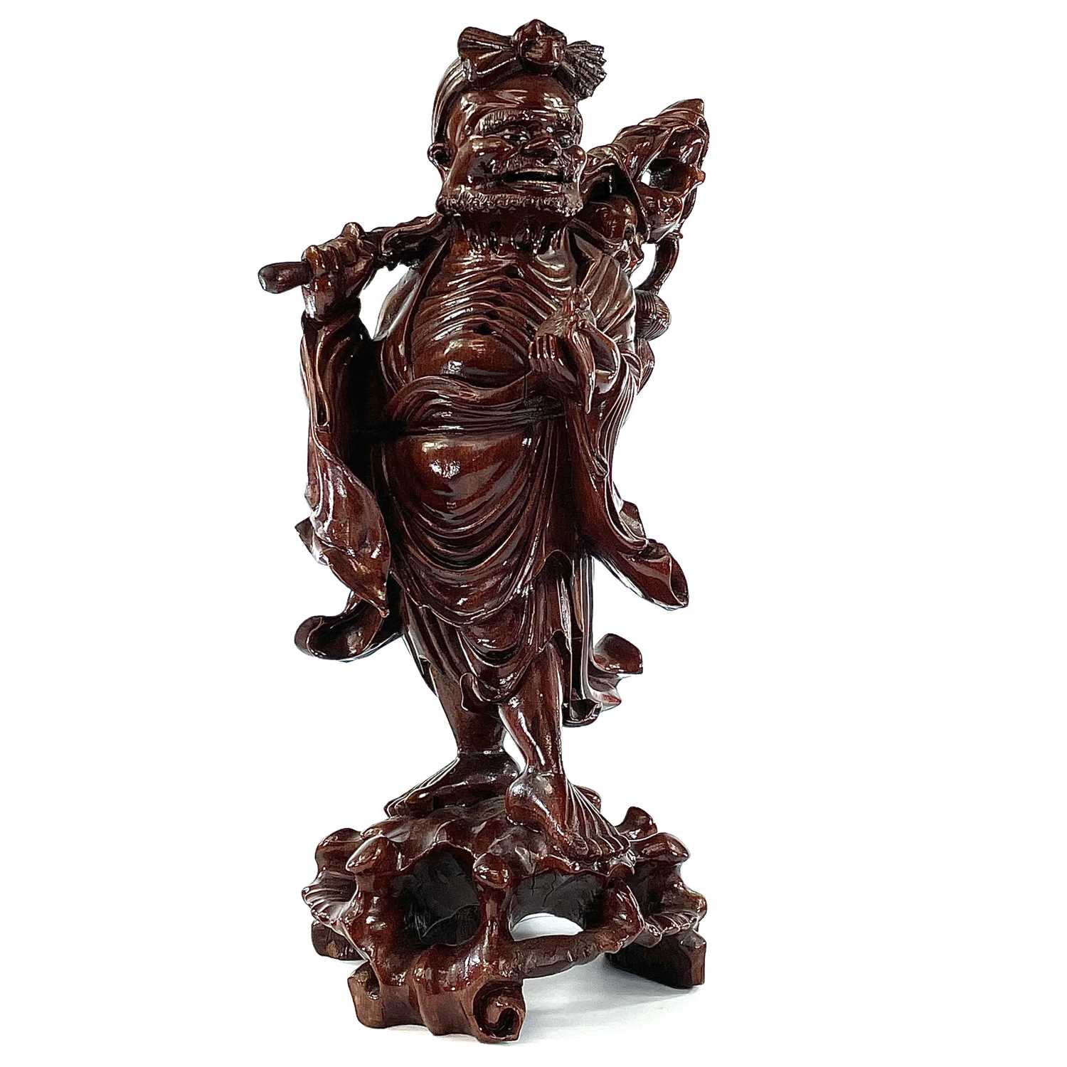 Lot 82 - A Chinese carved wood figure of a man carrying...