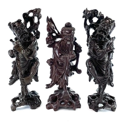 Lot 121 - A pair of Chinese carved hardwood figures, late 19th century.