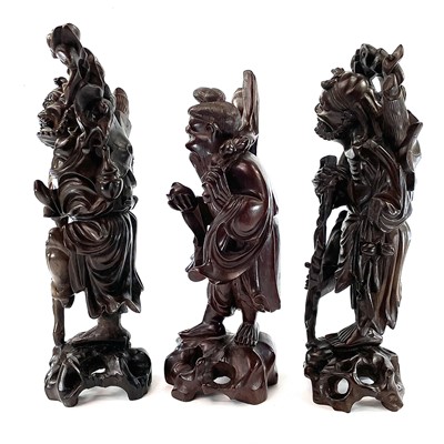 Lot 128 - A pair of Chinese carved hardwood figures,...