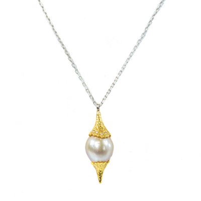 Lot 45 - A gold mounted diamond set South Sea pearl pendant