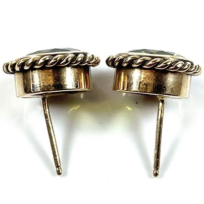 Lot 216 - A pair of 14ct gold peridot set stud earrings,...